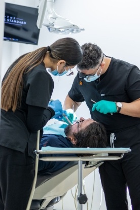 a closeup of a patient’s smile with dental implants