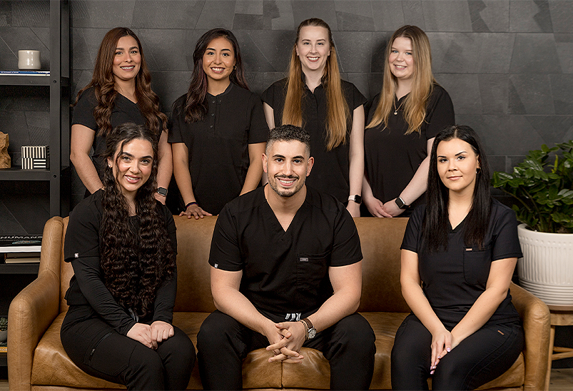 Smiling Schaumburg dentist and team members at The Smile Standard