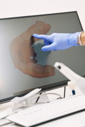 Smiling woman receiving dental treatment