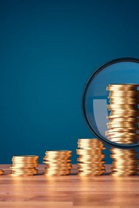 Tooth balanced against stacks of coins