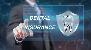 Pointing to graphic with the words “Dental Insurance”